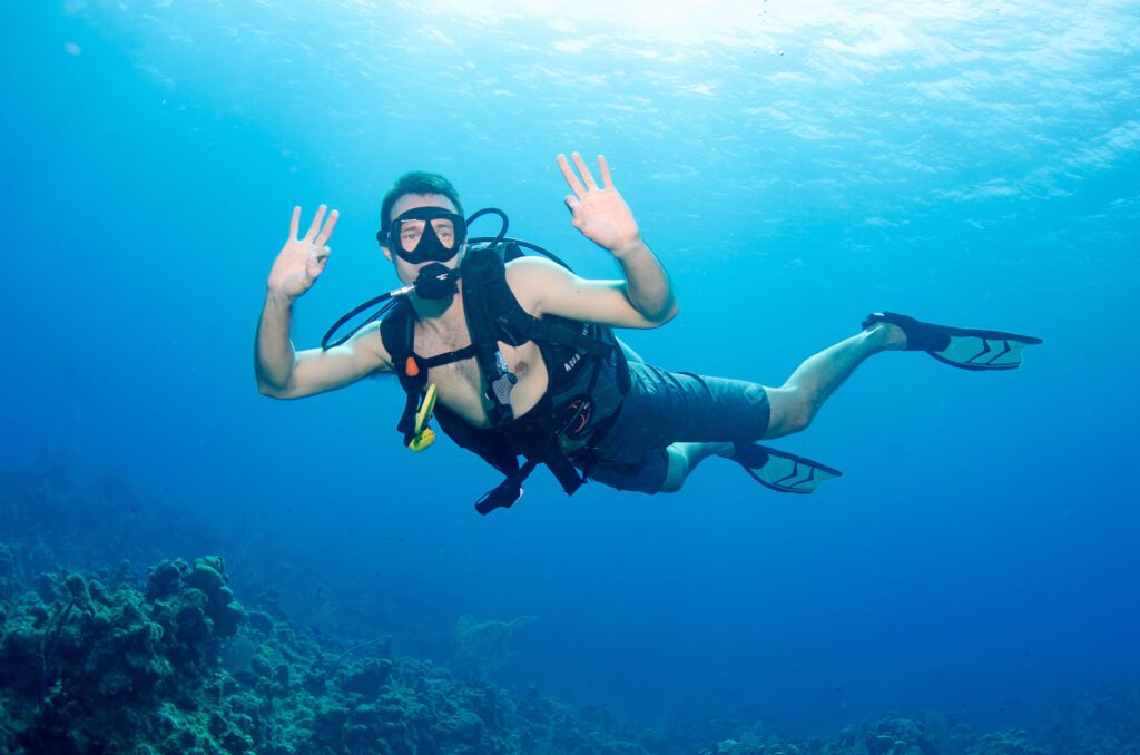 Man diving under water
