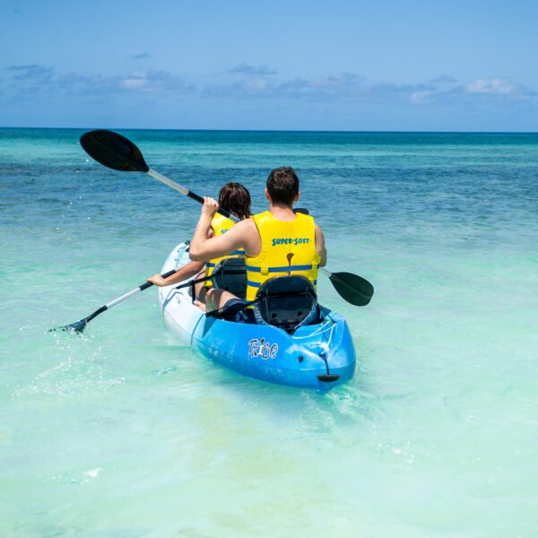 A man and a woman on a kayak in the ocean