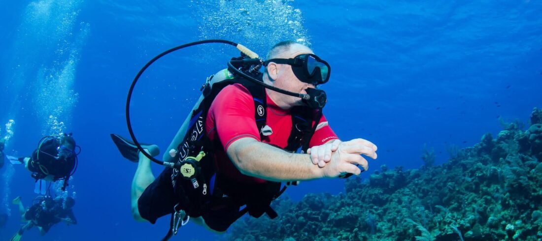 Man diving in cayman islands